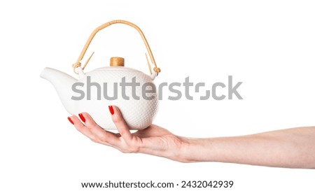 Similar – Image, Stock Photo Hand holding red cup with steaming drink against the light