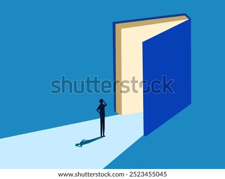 Wisdom. Businessman standing on the big open book door 