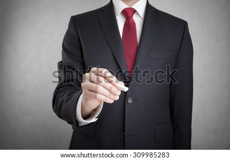 Businessman writing with chalk. You can add your own text.