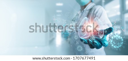 Healthcare and medicine, Covid-19, Doctor holding and diagnose  virtual Human Lungs with coronavirus spread inside on modern interface screen on hospital background, Innovation and Medical technology.