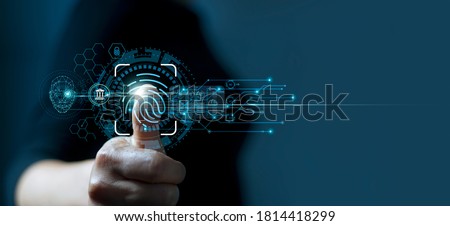 Businessman using fingerprint indentification to access personal financial data. Idea for E-kyc (electronic know your customer), biometrics security, innovation technology against digital cyber crime 商業照片 © 