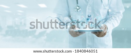 Healthcare and medicine, Doctor analyzing covid-19 coronavirus vaccine, Research and development successful develop vaccine and medicine for covid-19 pandemic. Electronic medical record on interface.