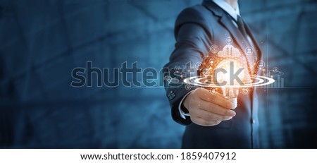 Businessman holding lightbulb and brain with network of business,  Modern executive management’s positive attitude, Growth mindset and developed new era in organization.