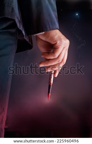 Businessman see the star target and hold pen be stained with blood, Business Halloween Concept