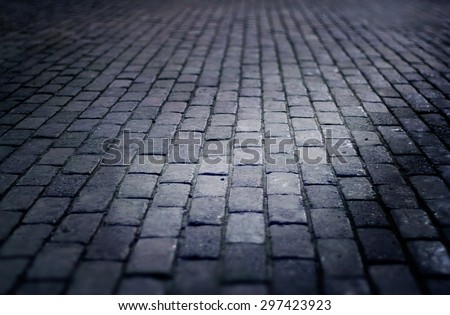 cobbled street floor tile old brick style at night, soft focus