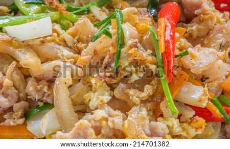 Close up shot of Stir-fried fresh rice-flour noodles with chicken and egg