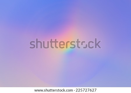 Abstract background of spin circle radial blur in rainbow colors with blue and purple background