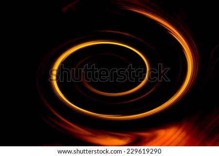 Abstract background of motion blur twirl in metallic gold, red, orange, and yellow, in dark background