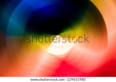 Abstract background of spin circle radial blur in rainbow colors, red, orange, yellow, blue, purple, green, and black