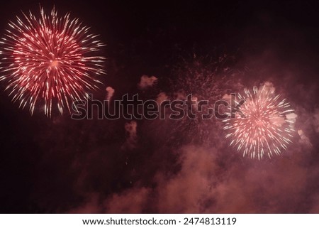 Similar – Image, Stock Photo Fireworks explode in two circles with yellow sparks from red smoke