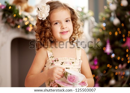 Little cute and sweet girl with tea