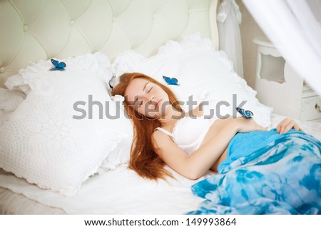 Beautiful woman in bed in the morning