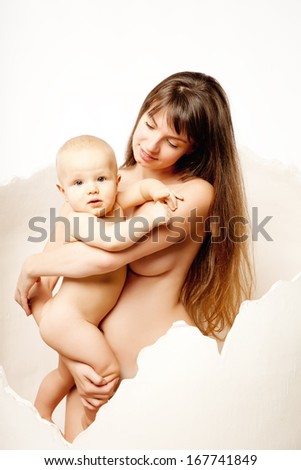 Kid with his young mother in the egg. Mom with baby in her arms. Family hug. Baby and his mum.