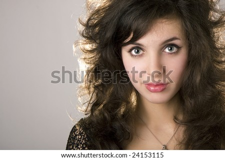 Image of a beautiful brunette model girl with curls