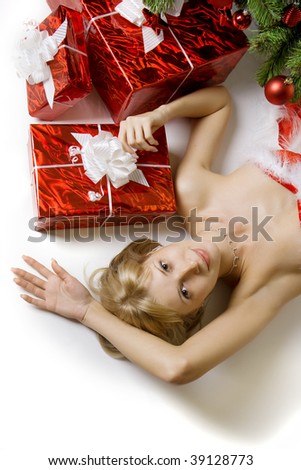 Images of the beautiful Santa girl lying under the tree