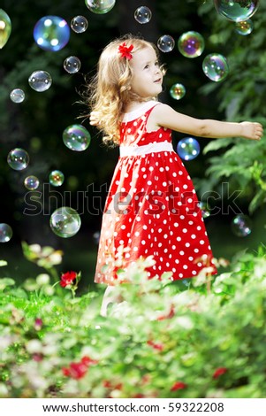 The image of a cute little girl with bubbles