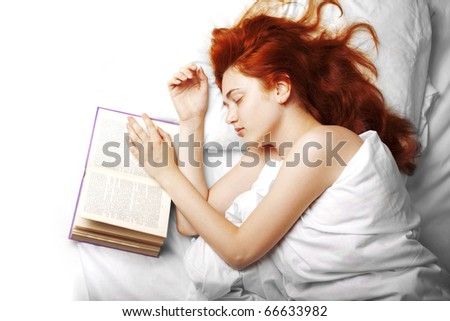 Image of a woman who reads a book in bed