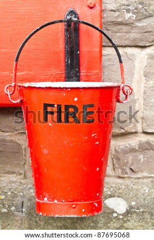 Single slightly battered fire bucket