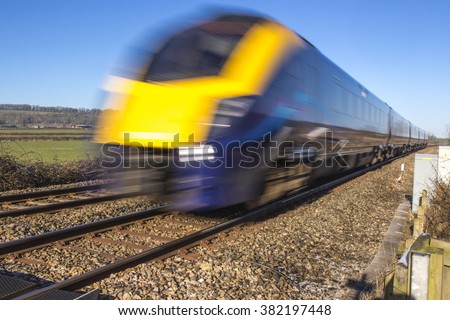 Similar – Image, Stock Photo A motion blurred close up shot of the fingers of a young adult Working from Home on a laptop kept on a wooden desk next to a pen and a notepad.