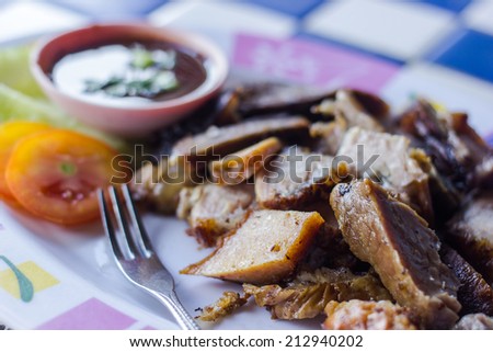 Grilled meat  on the plate with hot sauce