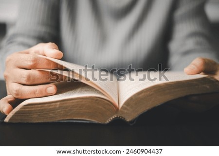 Similar – Image, Stock Photo Woman reading a book in cafe sitting at wooden table with flowers in a vase. Romantic date with a book. Brown vintage neutral color background. Literature & Library, book lover spending leisure time.