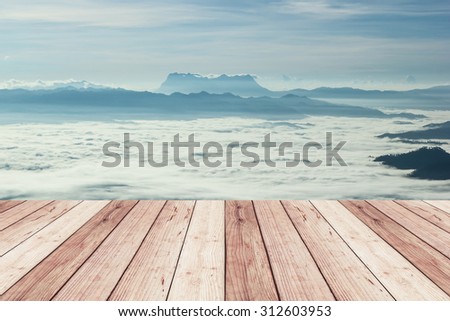 wood terrace with view of Huai Nam Dang national park in the morning with sea of mist ,Thailand for background