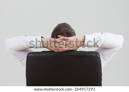 Business man leaning back in the chair