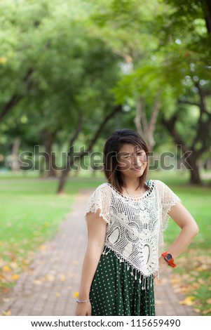 woman asian portrait in park.cute woman asian post portrait in park.