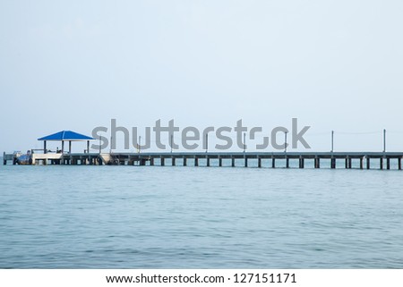Bridges, pavilion, bridges and out to sea with the mountains in the background.