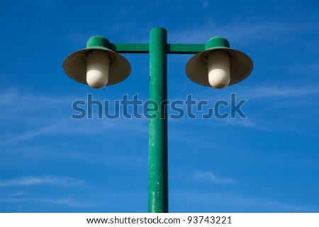 Light poles and the background is a dark sky, fresh
