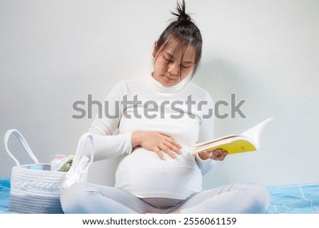 Similar – Foto Bild Serene schwangere Frau lesen Buch am Morgen