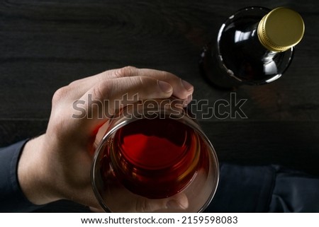 Man drinks alcohol at the table. Top view. Stock fotó © 