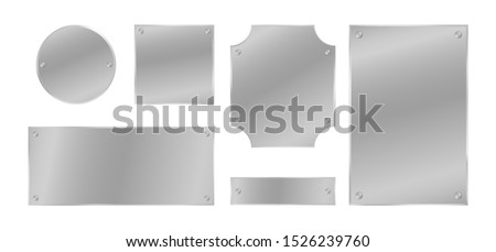 Metal plates with rivets set. Silver colored badges. Vector design elements
