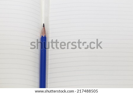 Notebook Page with Pencil