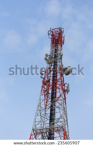 Telecommunications tower. Mobile phone base station with blue sky