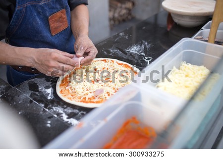 Pizza meister make a handmade pizza
