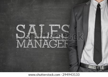 Sales manager on blackboard with businessman on side