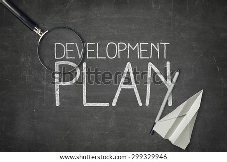 Development plan concept on black blackboard with empty paper sheet and coffee cup Сток-фото © 