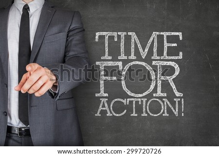Time for action on blackboard with businessman finger pointing