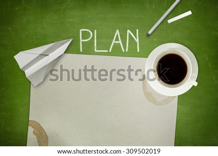 Plan concept on green blackboard with coffee cup and paper plane