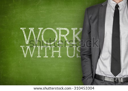Work with us on blackboard with businessman in a suit on side