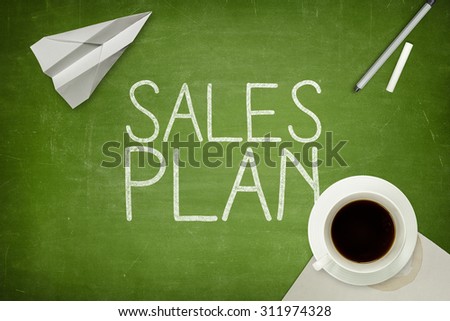 Sales plan concept on blackboard with coffee cup