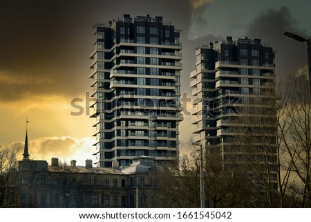 Modern glass building with reflected evening city and sunset sky in it. Foto stock © 