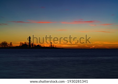 Beautiful nightly seascape with lighthouse and moody sky at the sunset. Сток-фото © 