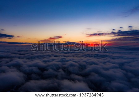 Photo of Aerial sunset view over the Blue Ridge Mountains from the cockpit of a private aircraft. Sky with clouds. Sky background