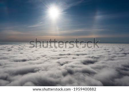 sunrise on blue sky. Blue sky with some clouds. View over the clouds. ストックフォト © 