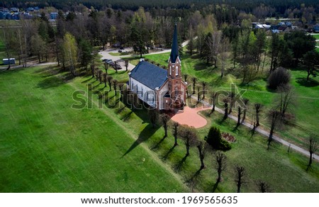 Beautiful white Catholic Church in Latvia ,Aglona, nice blue sky and white clouds. Green grass and trees. Сток-фото © 