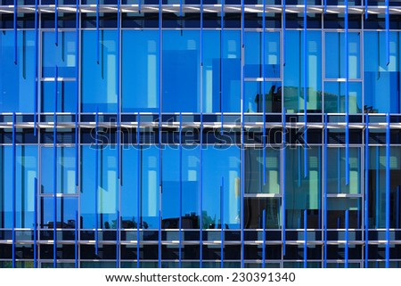 glass facade of a building with solar shading blue: detail