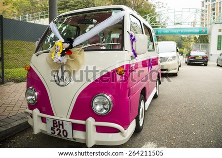 VINTAGE VOLKSWAGEN WEDDING CAR, HONG KONG - MAR 14: The vintage Volkswagen wedding car in Hong Kong on March 14, 2014. There are also a pair of dolls which is symbolic to the newly married couple.