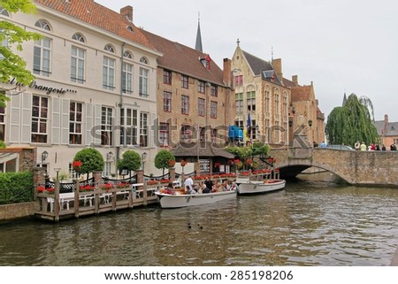 BRUGES, BELGIUM - JUNE 7,2011: Houses along the canals of Brugge or Bruges. Bruges is frequently referred to as \